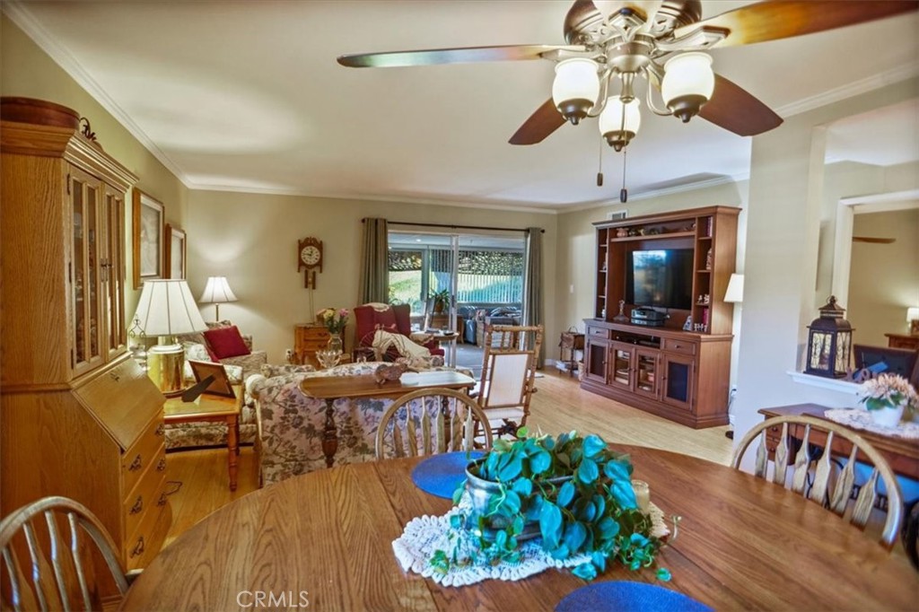 19334 Oak Crossing Road Newhall, CA 91321 - Photo 8 of 36 a living room with furniture dining area and a flat screen tv