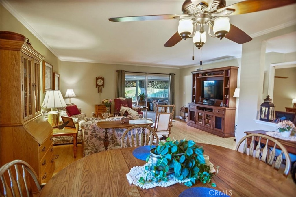 19334 Oak Crossing Road Newhall, CA 91321 - Photo 8 of 36 a living room with furniture dining area and a flat screen tv