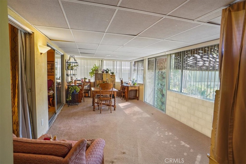 19334 Oak Crossing Road Newhall, CA 91321 - Photo 9 of 36 a view of a livingroom with furniture and floor to ceiling window