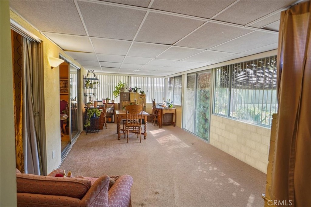 19334 Oak Crossing Road Newhall, CA 91321 - Photo 9 of 36 a view of a livingroom with furniture and floor to ceiling window