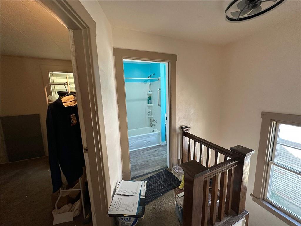 293 Lexington Court Carnegie, PA 15106 - Photo 17 of 47 a view of a hallway with wooden floor and stairs