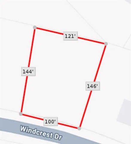 a utility room with shower and mirror