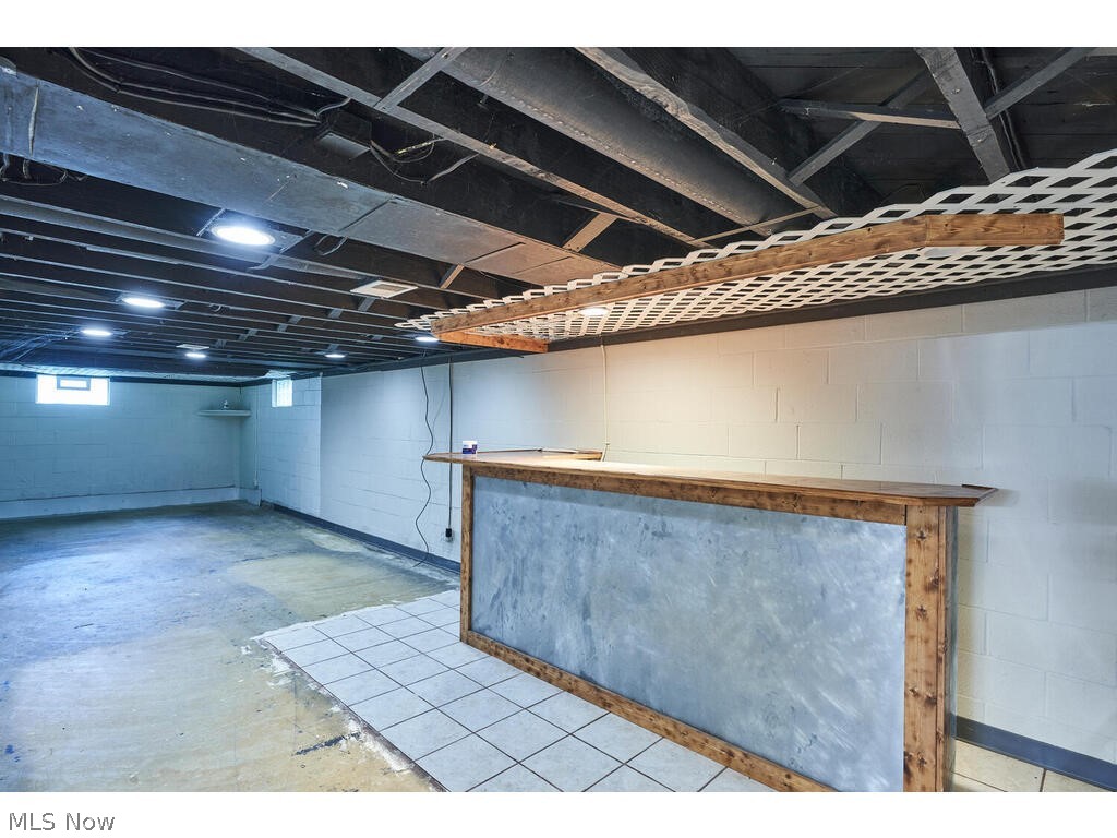 837 Brunsdorph Road Fairlawn, OH 44333 - Photo 21 of 35 Lower level with dry bar. Lower level was waterproofed, ready for flooring!