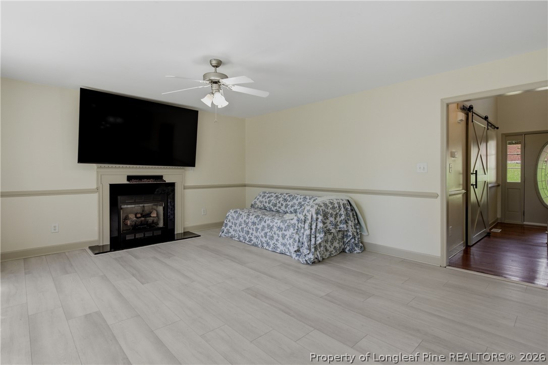1075 Buffalo Lake Road Sanford, NC 27332 - Photo 15 of 49 a living room with furniture and a flat screen tv
