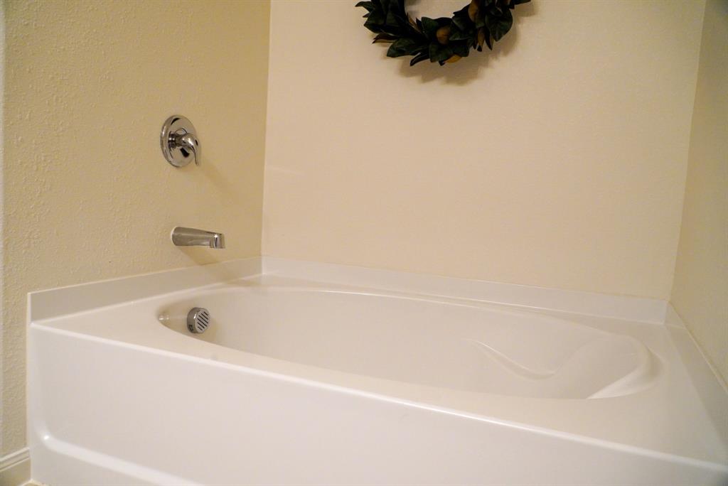13624 Helix Bridge Way Crowley, TX 76036 - Photo 21 of 25 a bathroom with a bathtub