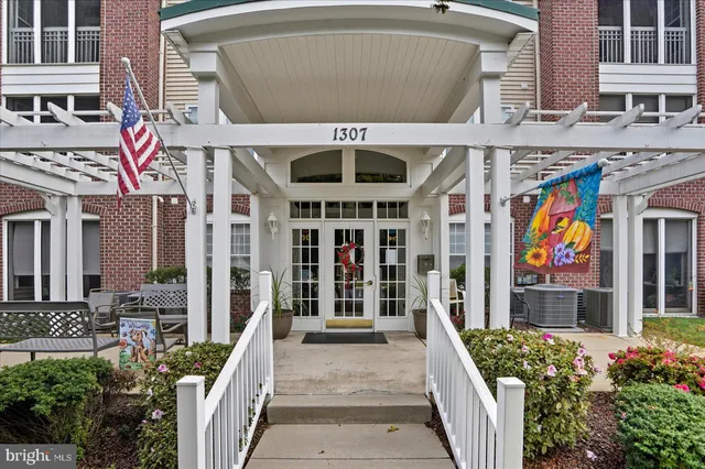 a front view of a building with garden