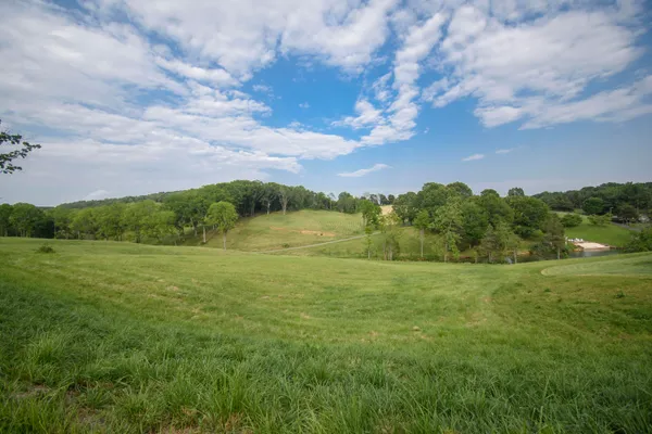 a view of a lake with a big yard