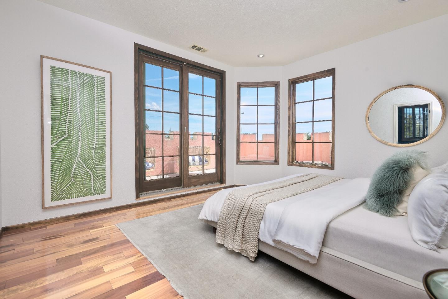 17035 Bohlman Road Saratoga, CA 95070 - Photo 13 of 27 a bedroom with a large bed and a large window