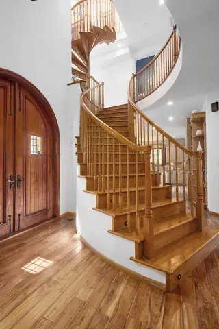 a view of entryway with wooden floor