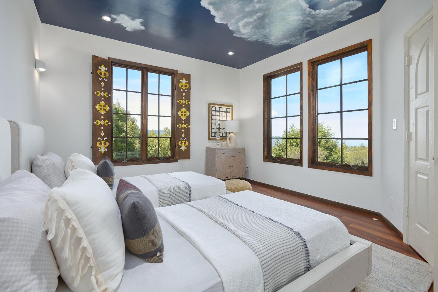 17035 Bohlman Road Saratoga, CA 95070 - Photo 15 of 27 a bedroom with bed and a large window