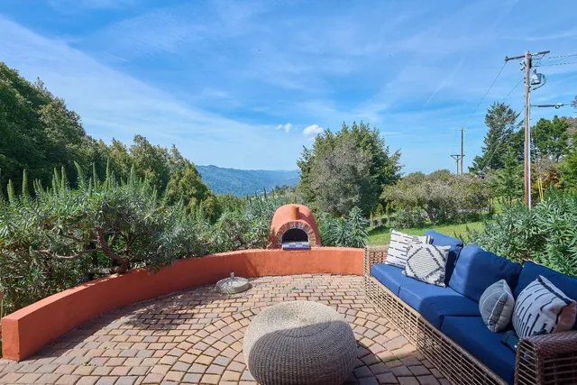 a view of a balcony with furniture