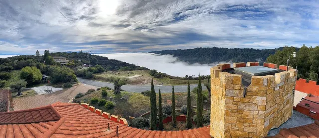 a view of a balcony with an outdoor seating
