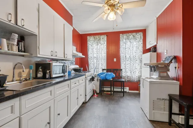 a kitchen with stainless steel appliances granite countertop a sink and cabinets