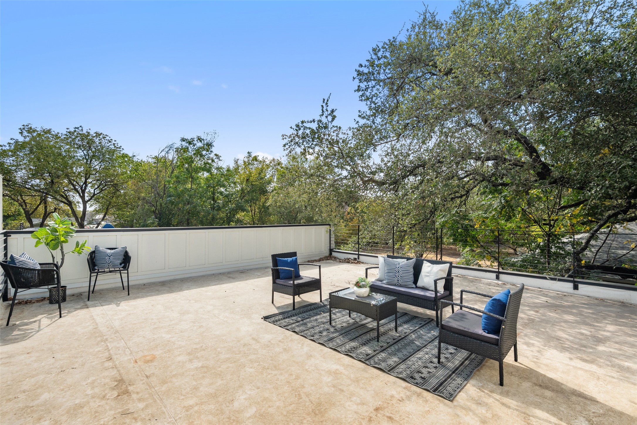 4407 Merle Drive, Unit A Austin, TX 78745 - Photo 32 of 37 a view of a patio with a table and chairs