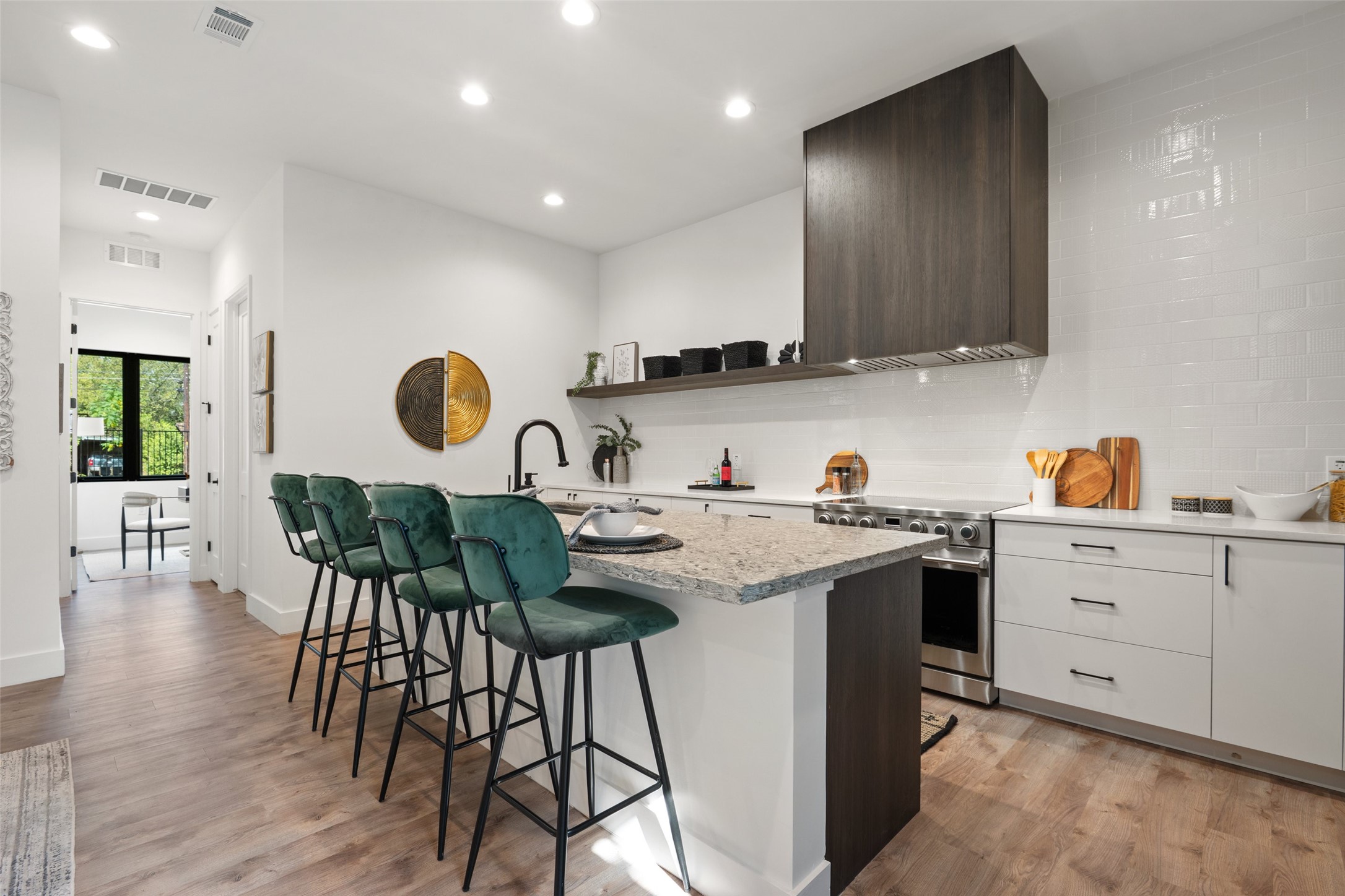 4407 Merle Drive, Unit A Austin, TX 78745 - Photo 10 of 37 a kitchen with a sink cabinets and wooden floor