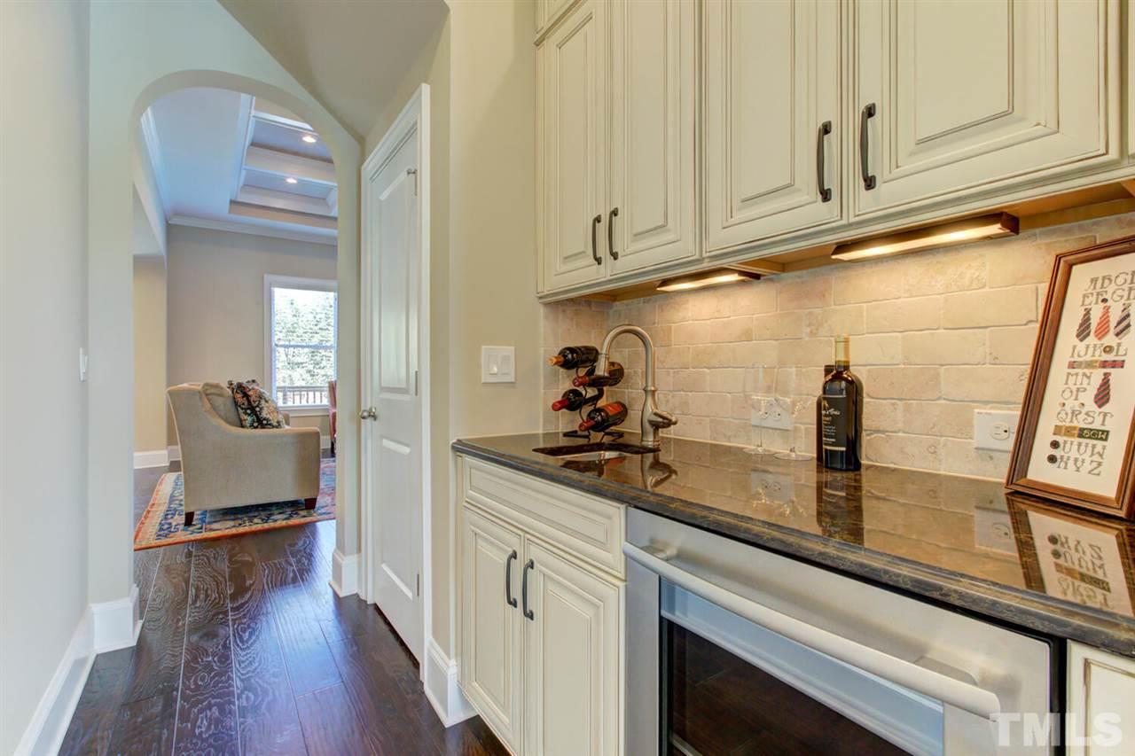 8205 Cranes View Place East Raleigh, NC 27615 - Photo 13 of 30 a kitchen with stainless steel appliances granite countertop a sink and cabinets