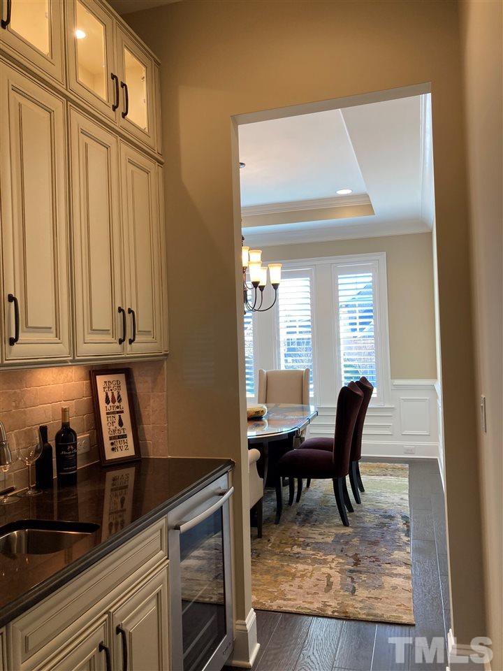 8205 Cranes View Place East Raleigh, NC 27615 - Photo 14 of 30 a view of a kitchen area with furniture and staircase