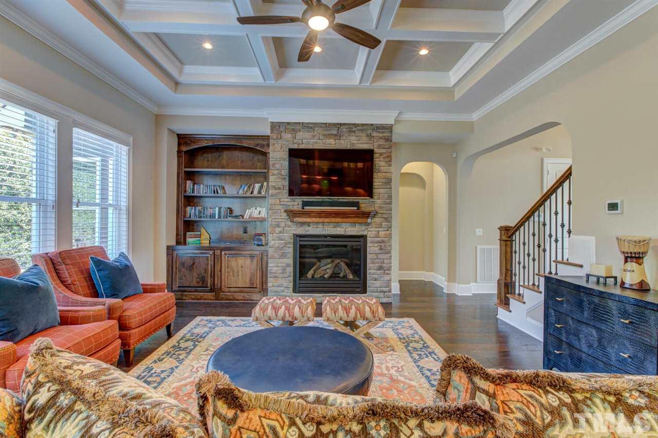 8205 Cranes View Place East Raleigh, NC 27615 - Photo 16 of 30 a living room with furniture and a fireplace