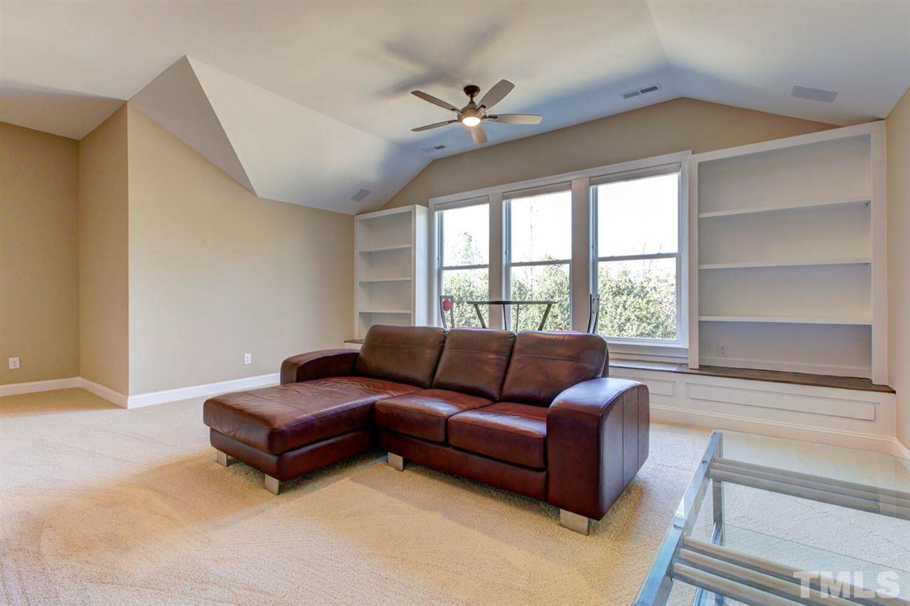 8205 Cranes View Place East Raleigh, NC 27615 - Photo 26 of 30 a living room with furniture and a large window