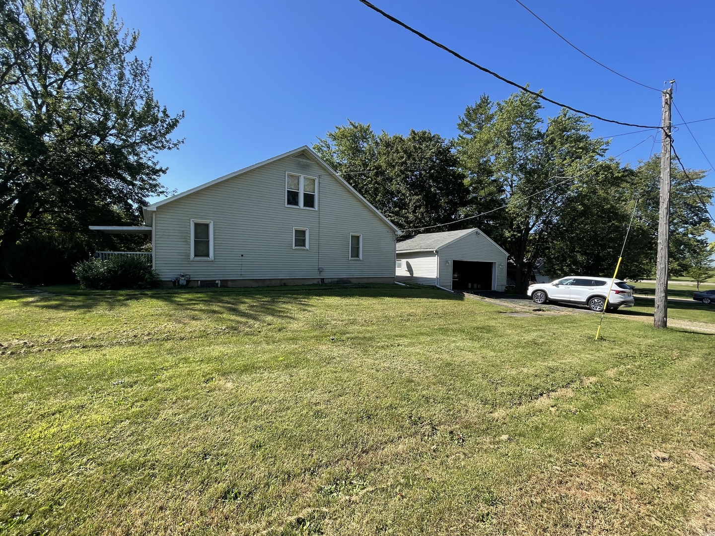 202 South Pleasant Street Rutland, IL 61358 - Photo 3 of 13 a front view of a house with garden