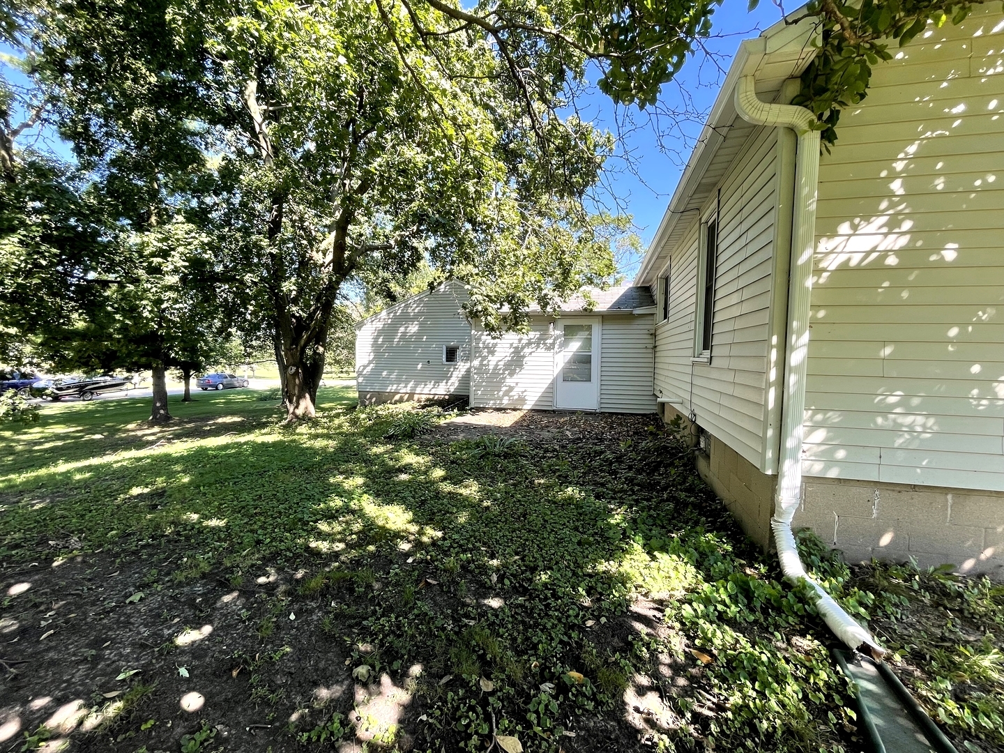 202 South Pleasant Street Rutland, IL 61358 - Photo 4 of 13 a backyard of a house with lots of green space