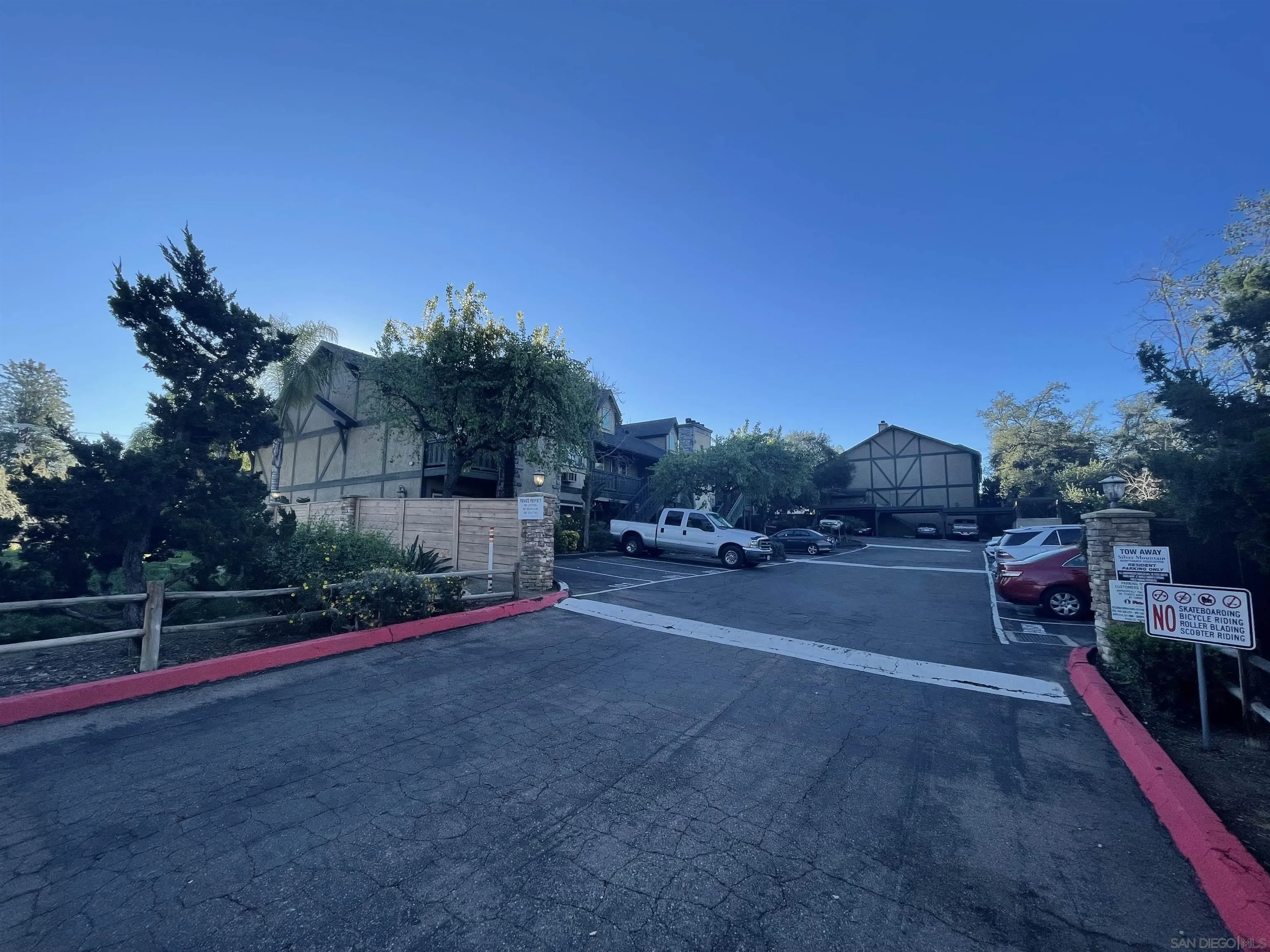 1434 Marshall Road, Unit 56 Alpine, CA 91901 - Photo 3 of 15 a view of road with wooden fence
