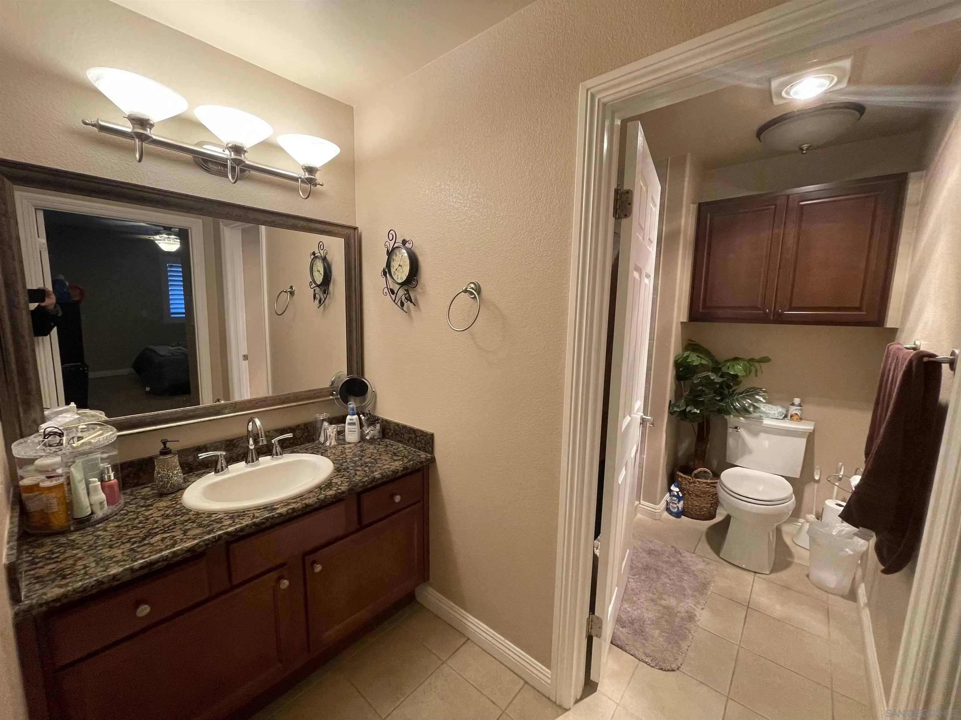 1434 Marshall Road, Unit 56 Alpine, CA 91901 - Photo 7 of 15 a spacious bathroom with a granite countertop sink and a mirror
