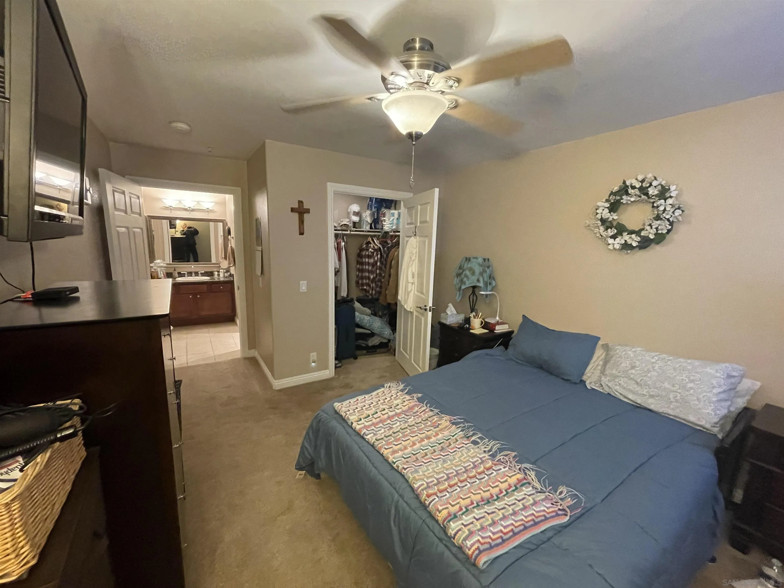 1434 Marshall Road, Unit 56 Alpine, CA 91901 - Photo 9 of 15 a bedroom with a large bed and a chandelier