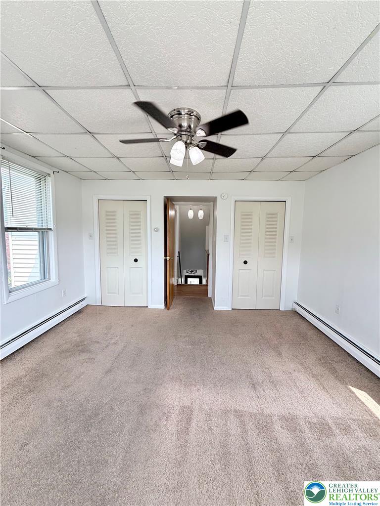 5540 Main Street Whitehall, PA 18052 - Photo 30 of 53 A comfortable bedroom features carpeted flooring and practical closet space.