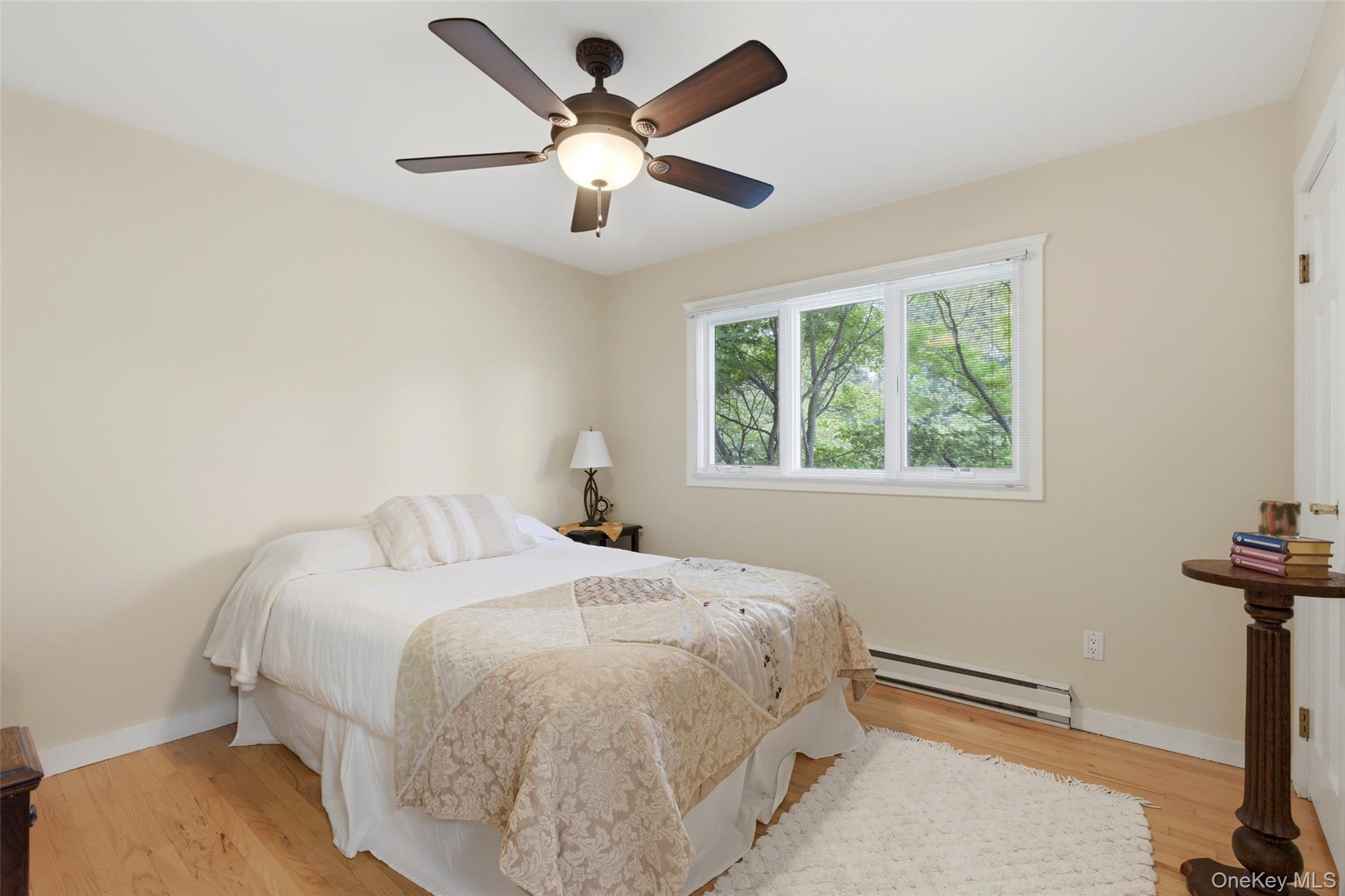 7 Gun Path Setauket, NY 11733 - Photo 21 of 34 a bedroom with a bed and a window