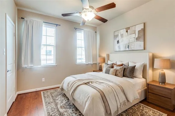 a bedroom with bed and a window