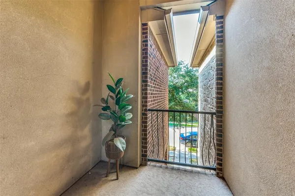 a house with potted plant in front of it