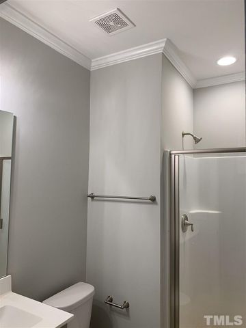 a white bathroom with sink