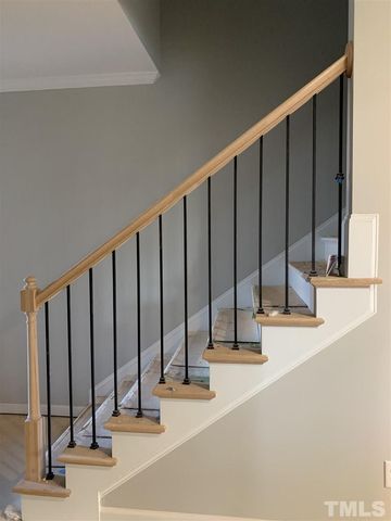 a view of staircase with wooden floor