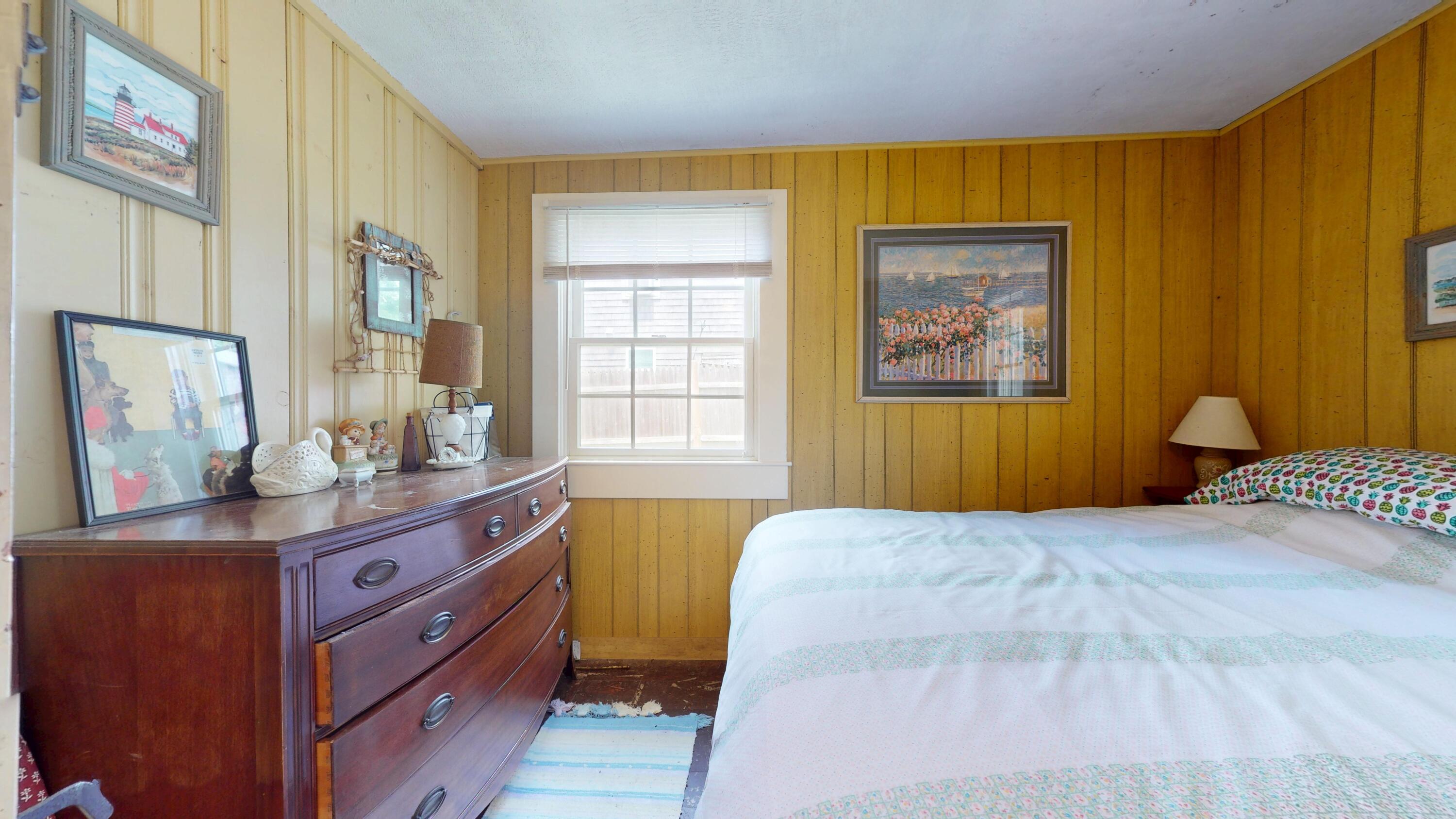 18 Myrtle Lane Dennis Port, MA 02639 - Photo 13 of 25 a bedroom with a bed and wooden floor