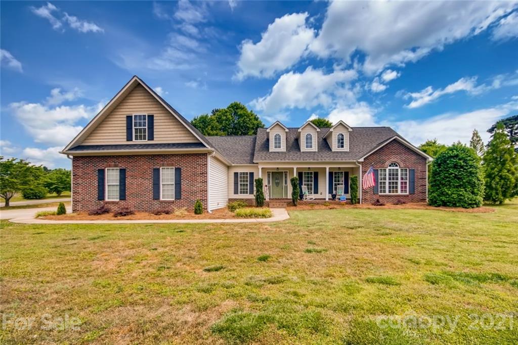 1682 Lane Road Mount Holly, NC 28120 - Photo 1 of 23 a front view of a house with a yard