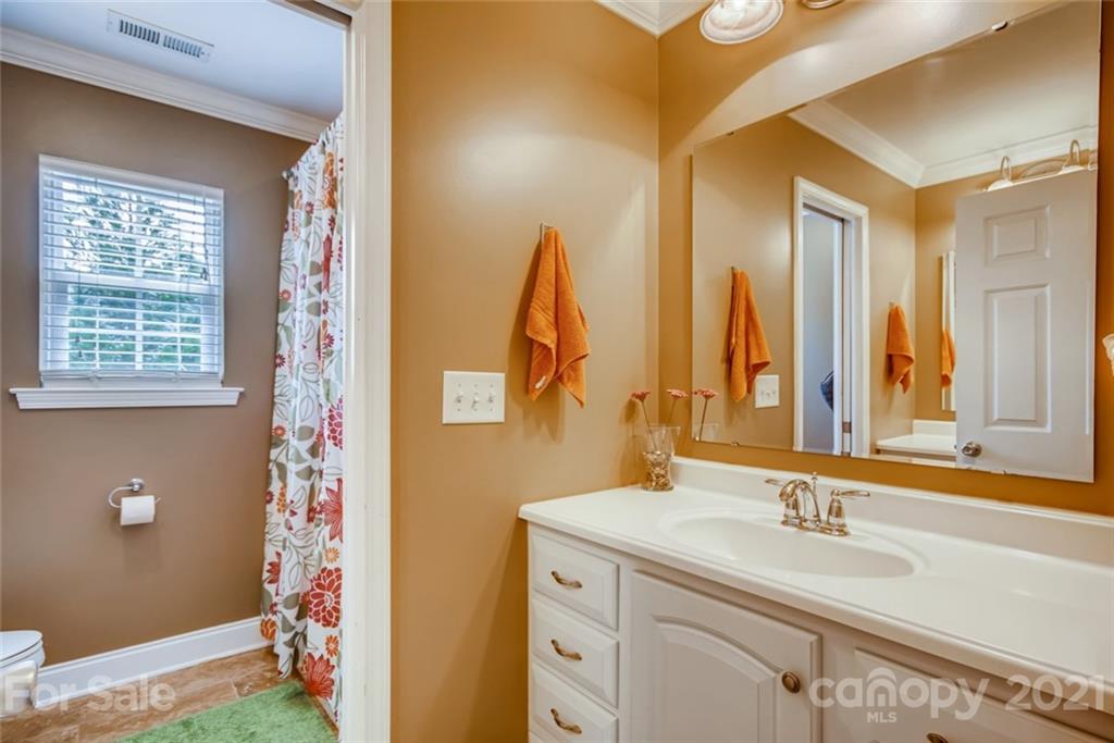 1682 Lane Road Mount Holly, NC 28120 - Photo 12 of 23 a bathroom with a sink and a mirror