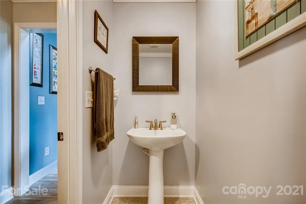 1682 Lane Road Mount Holly, NC 28120 - Photo 14 of 23 a bathroom with a sink and a mirror