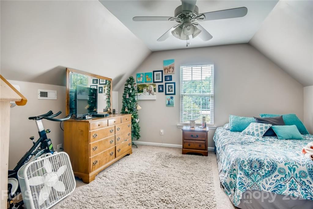 1682 Lane Road Mount Holly, NC 28120 - Photo 19 of 23 a bedroom with a bed and wooden floor