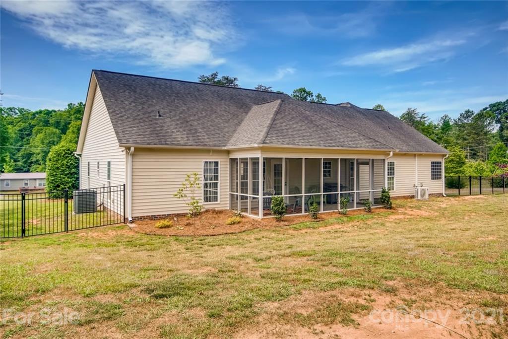 1682 Lane Road Mount Holly, NC 28120 - Photo 22 of 23 a front view of a house with a garden