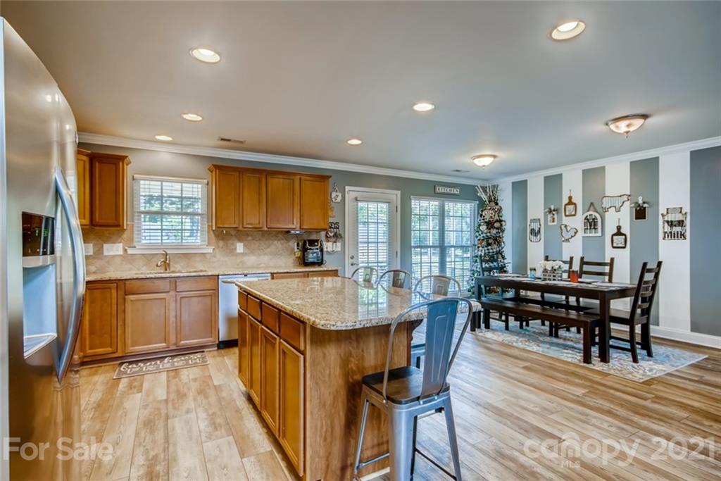 1682 Lane Road Mount Holly, NC 28120 - Photo 9 of 23 a kitchen with counter top space and wooden floor
