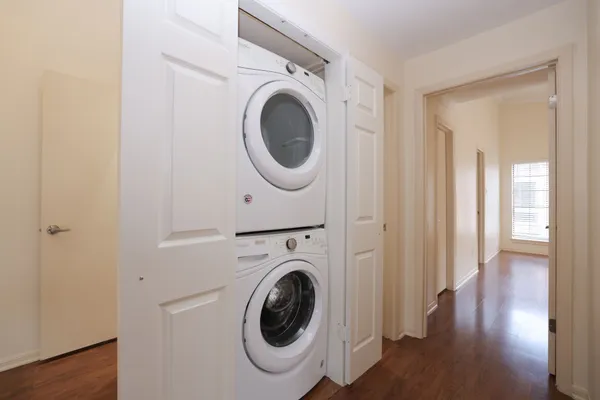 a view of a hallway with washer and dryer