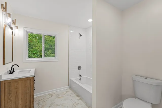 a bathroom with a sink vanity and a mirror