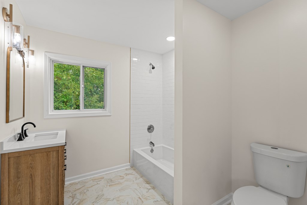 5915 Frazier Drive Columbus, GA 31909 - Photo 15 of 28 a bathroom with a bathtub toilet and sink