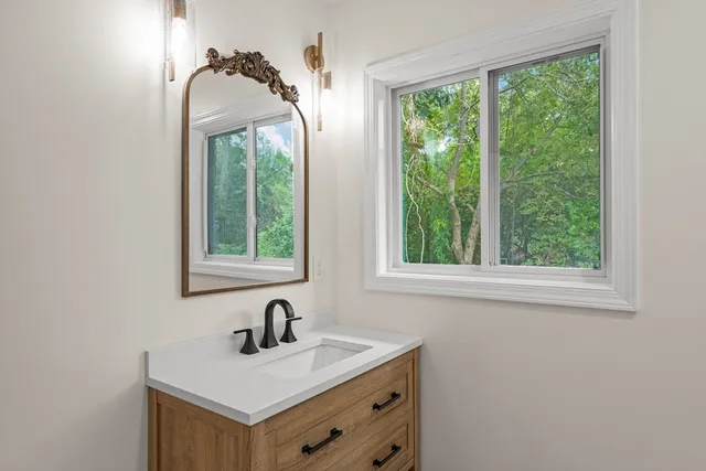 a bedroom with a bed and a lamp