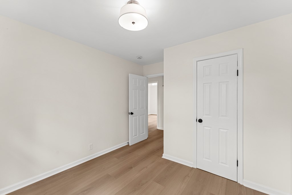 5915 Frazier Drive Columbus, GA 31909 - Photo 19 of 28 an empty room with wooden floor and window