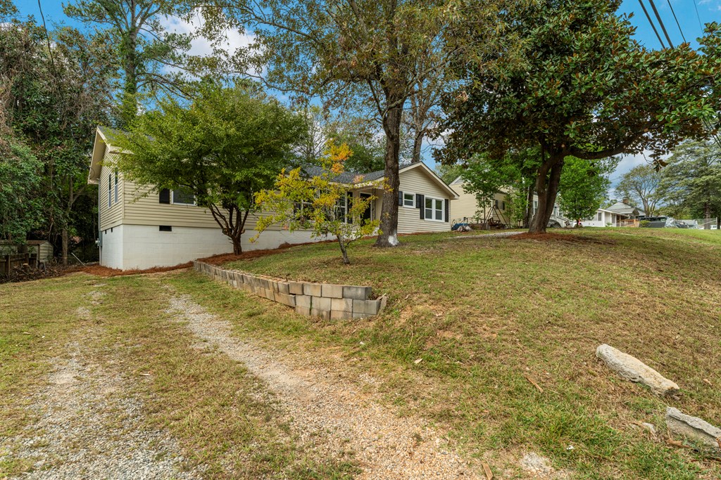 5915 Frazier Drive Columbus, GA 31909 - Photo 27 of 28 a view of a house with a yard and large tree