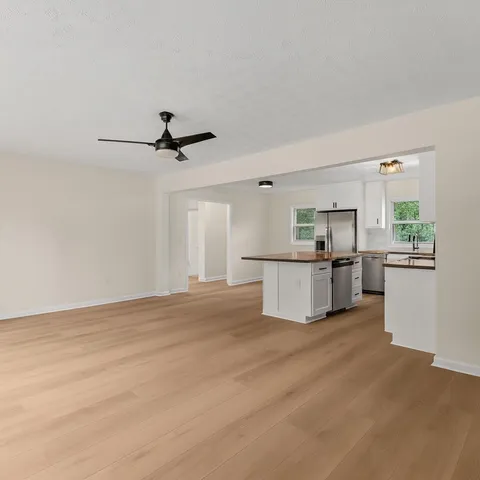 a view of an empty room with a window