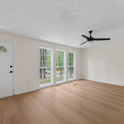 a view of an empty room with a window