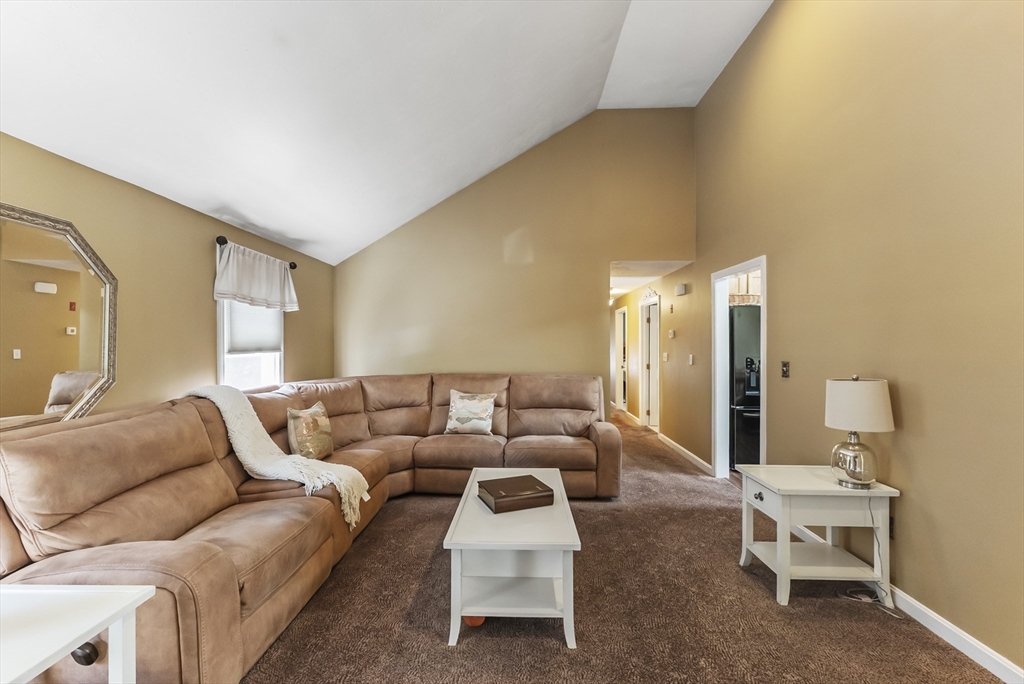 67 Roxy Cahoon Road Plymouth, MA 02360 - Photo 12 of 37 a living room with furniture and wooden floor
